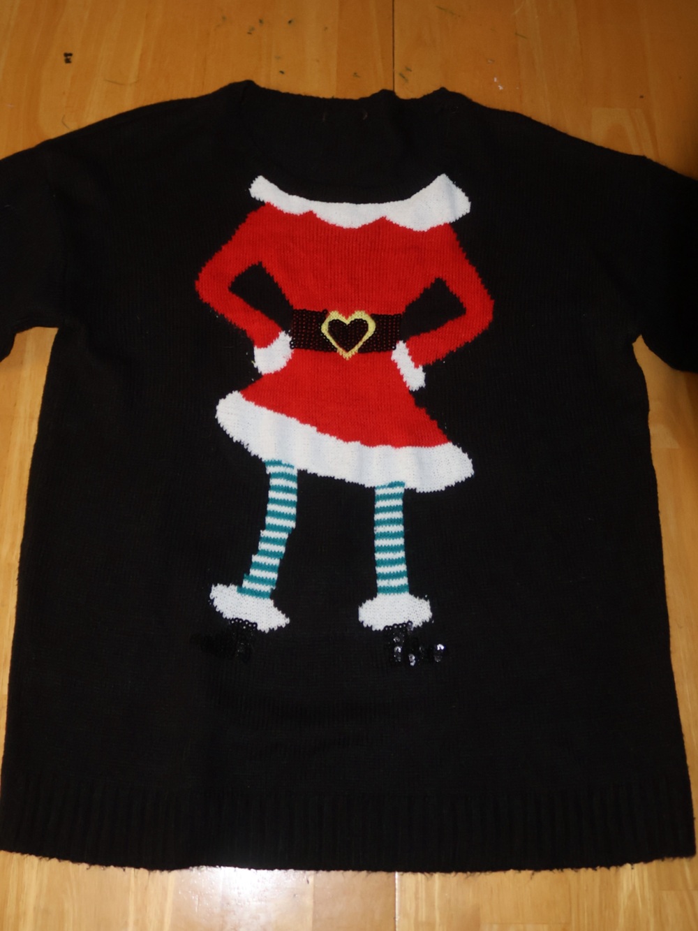 Black Holiday Sweater with Red and White Santa Design
